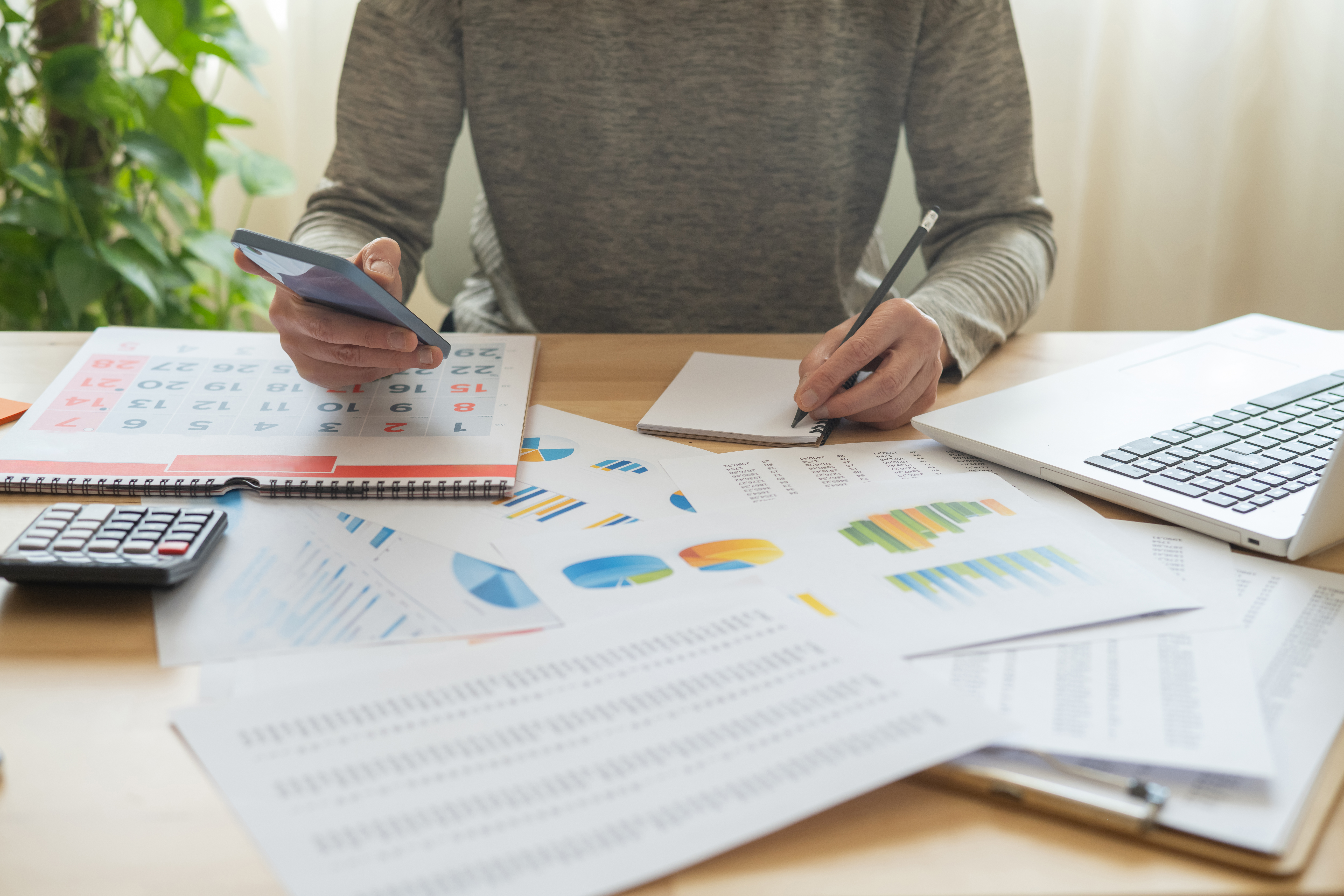 person-managing-business-finances-bills-and-sche-2026-01-11-10-50-05-utc